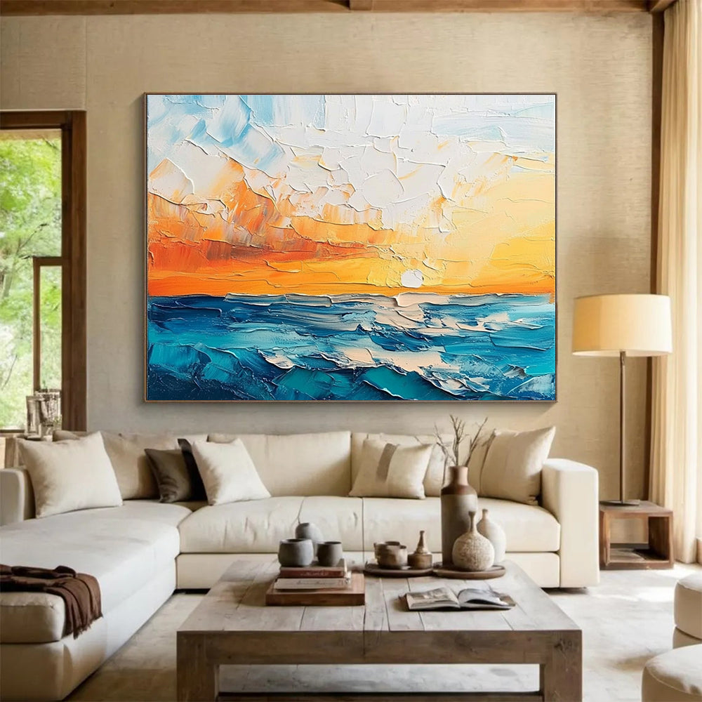 Large abstract painting featuring a textured sunset over the sea and sky in orange blue white and teal shades.SC132