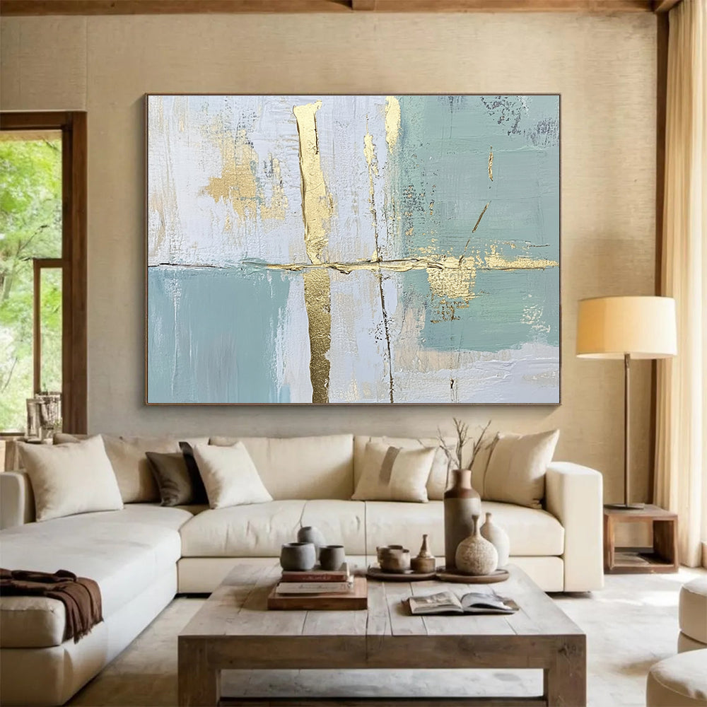Large abstract painting with pale green and blue lines and shapes enhanced by gold foil accents for an elegant touch.SC326