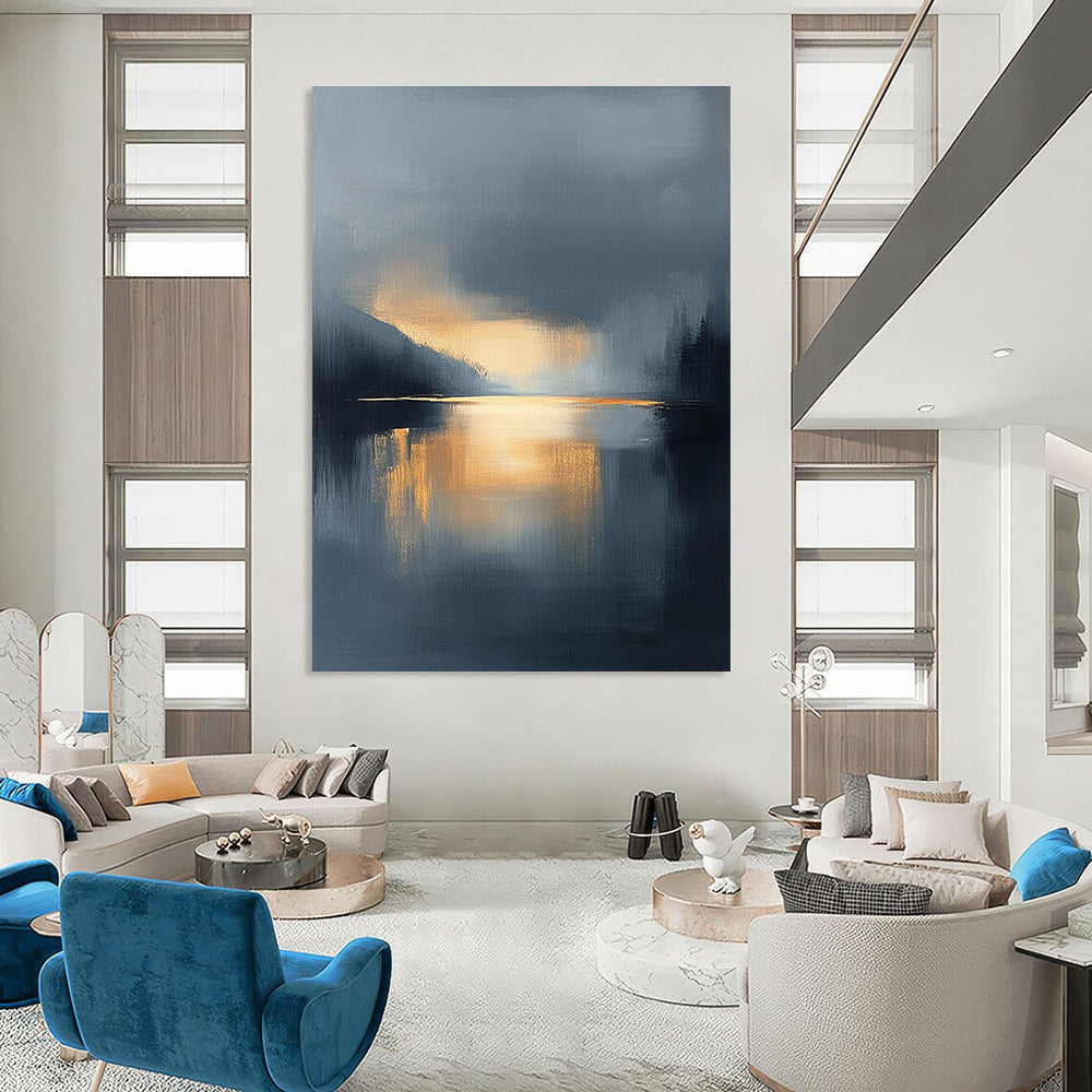 Large abstract oil painting featuring a lake and sky with navy blue and gold tones atmospheric clouds and reflections in calm waters.STSC167