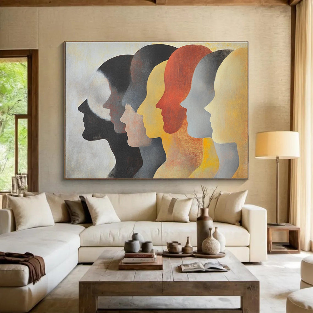 Large abstract painting featuring faces in profile with diverse skin tones and hairstyles in soft colors on a light background.SC548