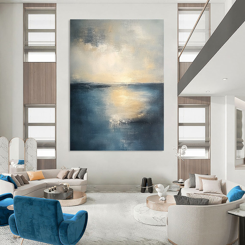 Abstract seascape in muted blue and grey tones with warm yellow sunlight evoking tranquility and reflection on canvas using soft oil paint gradients.STSC461