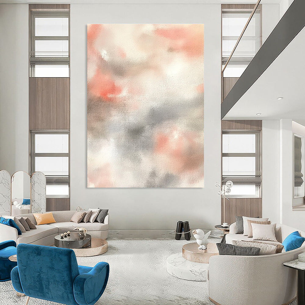 Large abstract painting featuring soft pinks whites and light gray clouds on a beige background creating a serene atmosphere.STSC1462