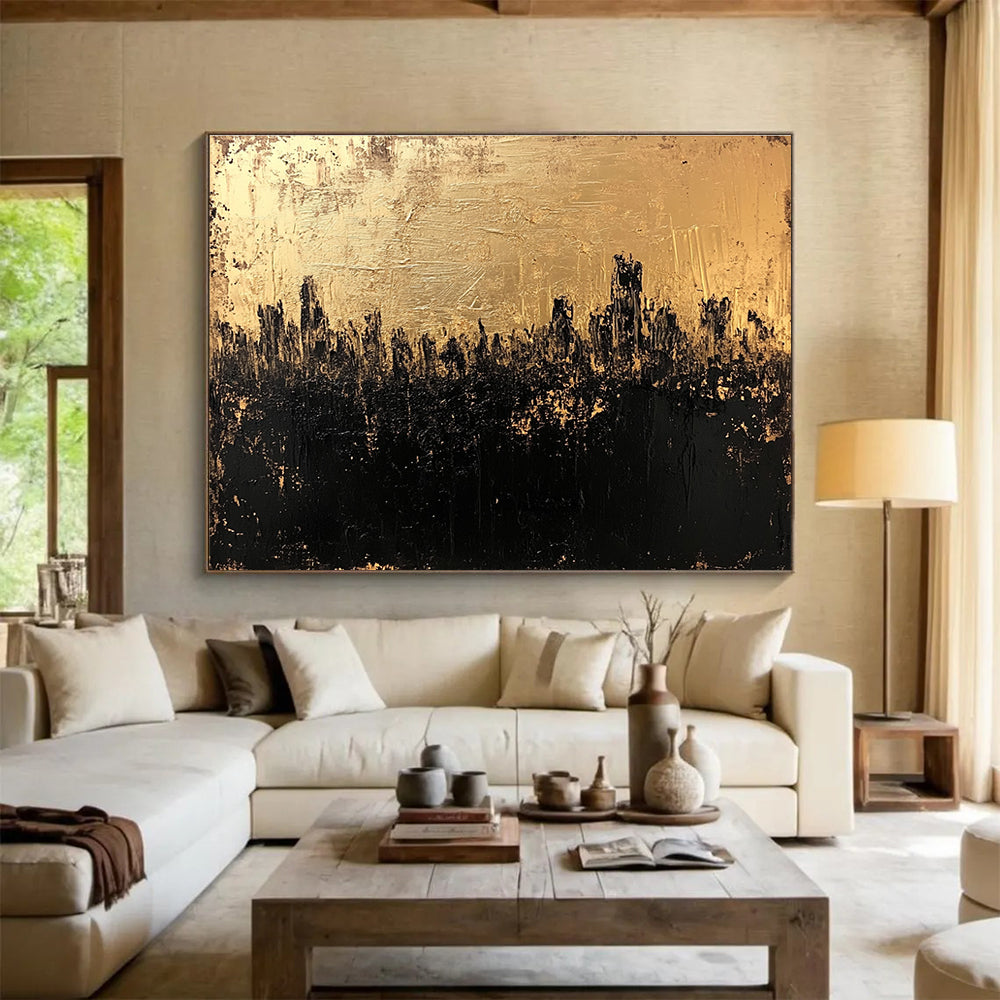 Large abstract painting in gold and black featuring a textured surface that captures a dark cityscape with an atmospheric moody quality.SC143