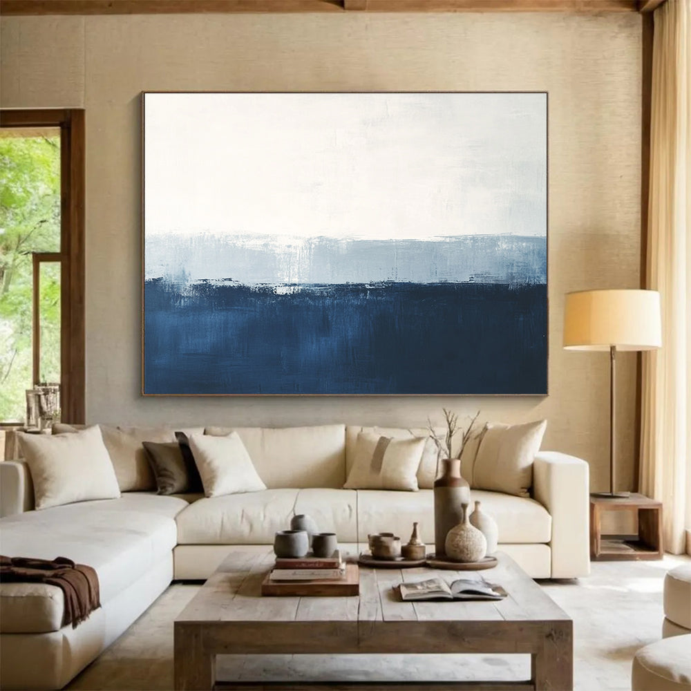 Large abstract painting in calming blue and white with subtle textures tranquil sea view soft edges and atmospheric skies.SC027