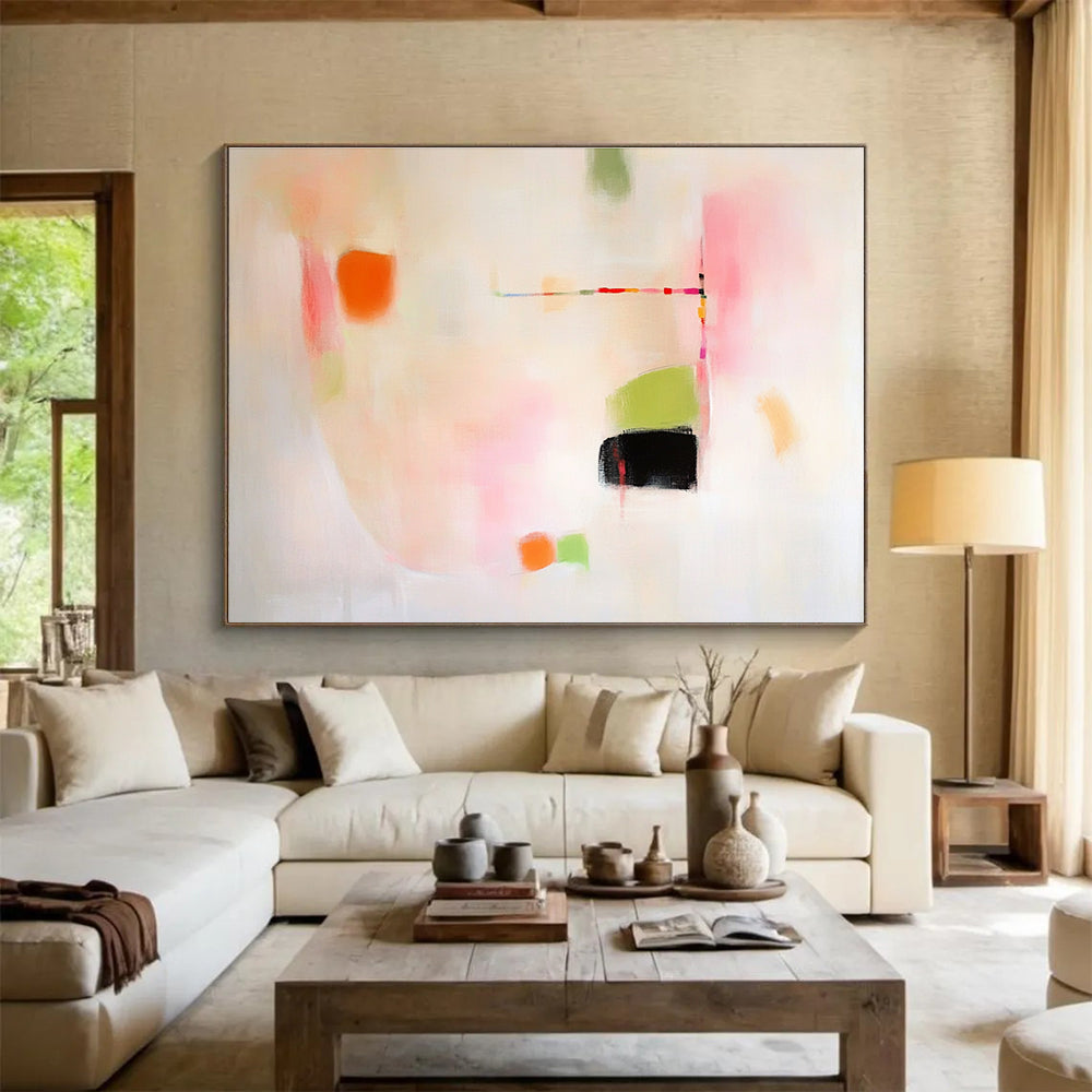 Large abstract painting featuring pink green and orange shapes on white background evoking calmness with gentle curves and contrasting black spaces.SC379