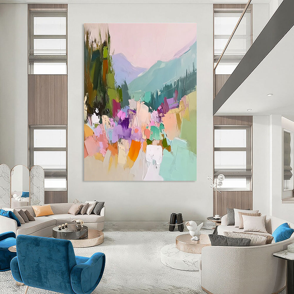 Large abstract painting featuring vibrant colors with trees flowers and mountains showcasing thick brush strokes and textured canvas in a harmonious light pink sky.STSC104
