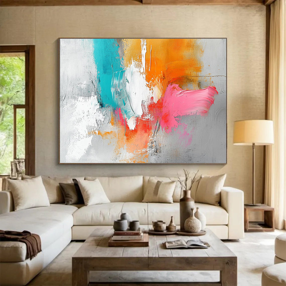 Large abstract painting featuring a light gray background with orange and pink splashes, white brush strokes, and vibrant blue accents.SC148