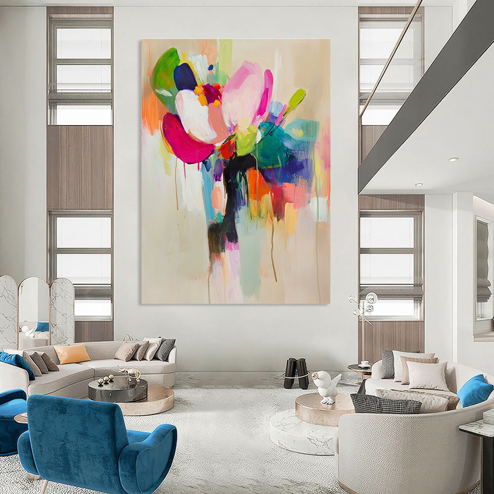 Large abstract painting featuring vibrant colors and soft brushstrokes with a flower in a vase on a light beige background.STSC822