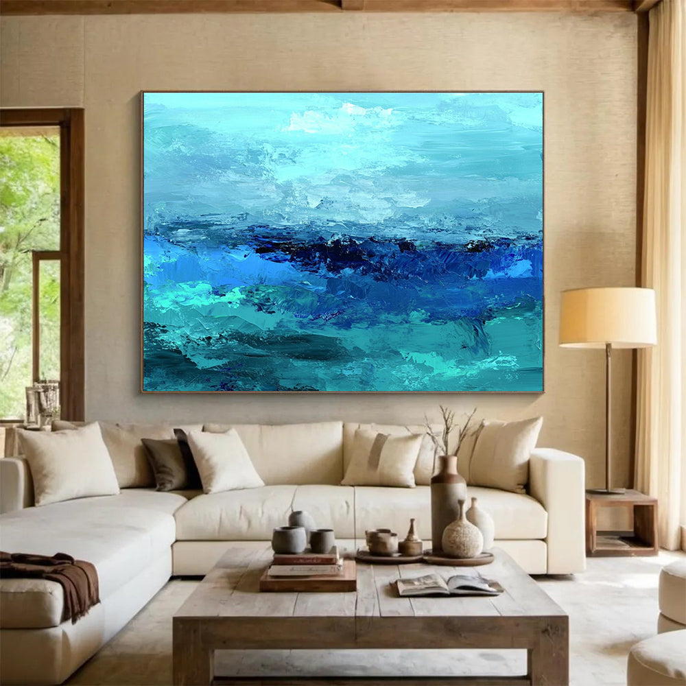 Large abstract ocean artwork in shades of aqua teal and navy with textured layers suggesting waves evokes tranquility and depth on canvas.SC035