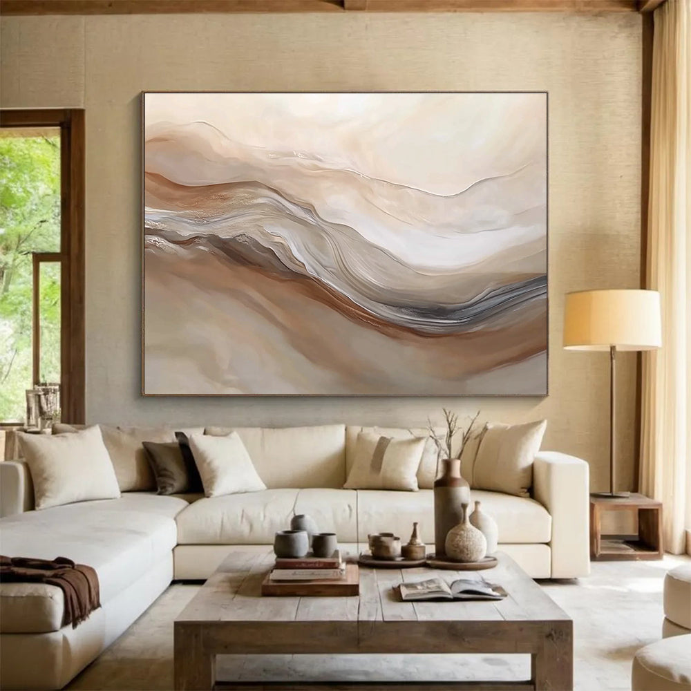 Large abstract painting featuring swirling beige and white hues resembling desert dunes capturing movement and depth in a serene landscape.SC447