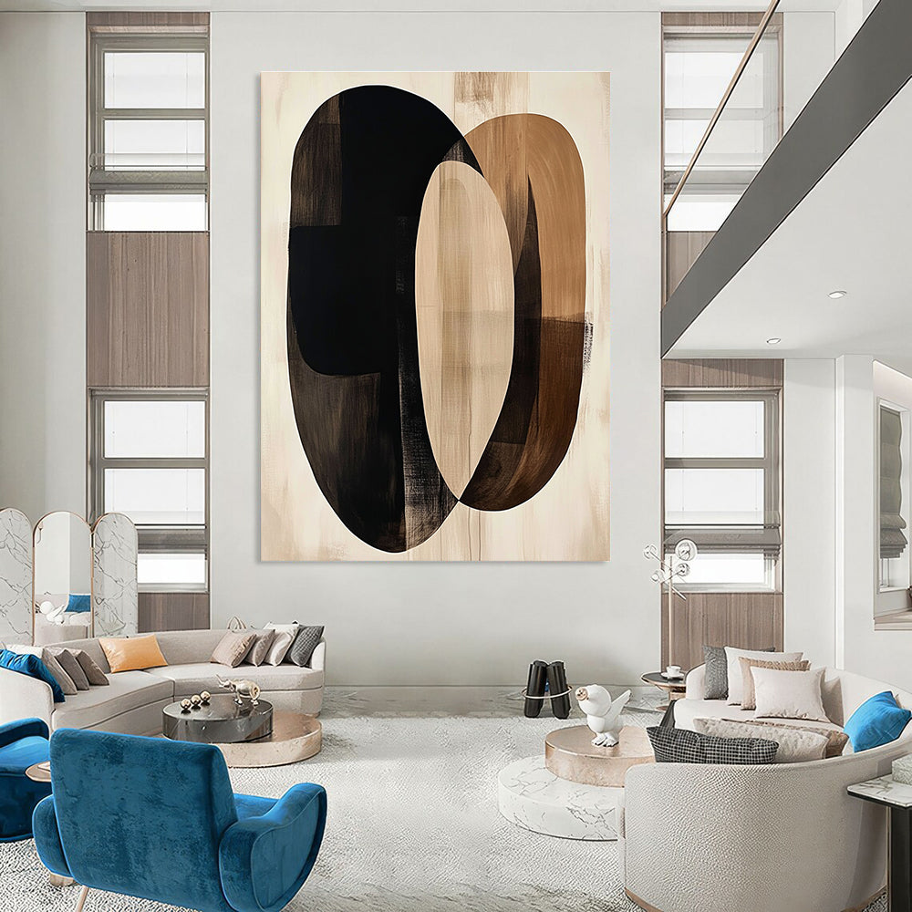 Large abstract artwork featuring fluid beige and black shapes with dark brown ovals on a cream background evokes tranquility through minimalist design.STSC470