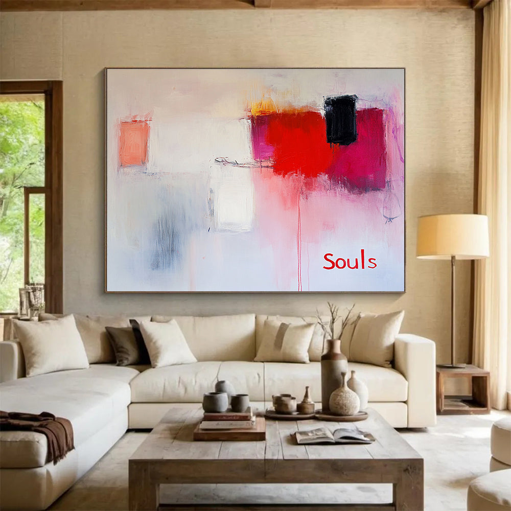 Large abstract painting in soft pinks and whites with red hints features expressive brushstrokes and the word Souls in a minimalist style.SC139