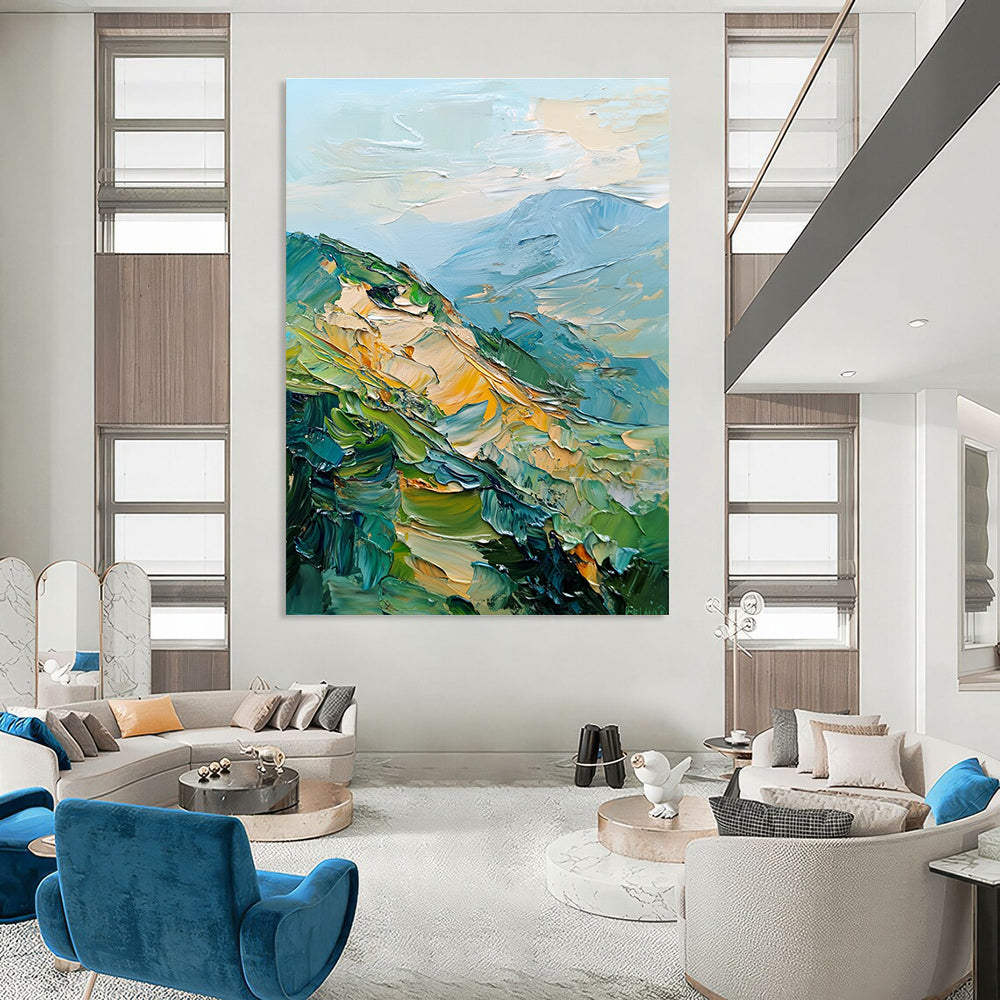 Large abstract painting of mountains featuring palette knife texture and thick brush strokes in a blend of greens blues and golds.STSC192