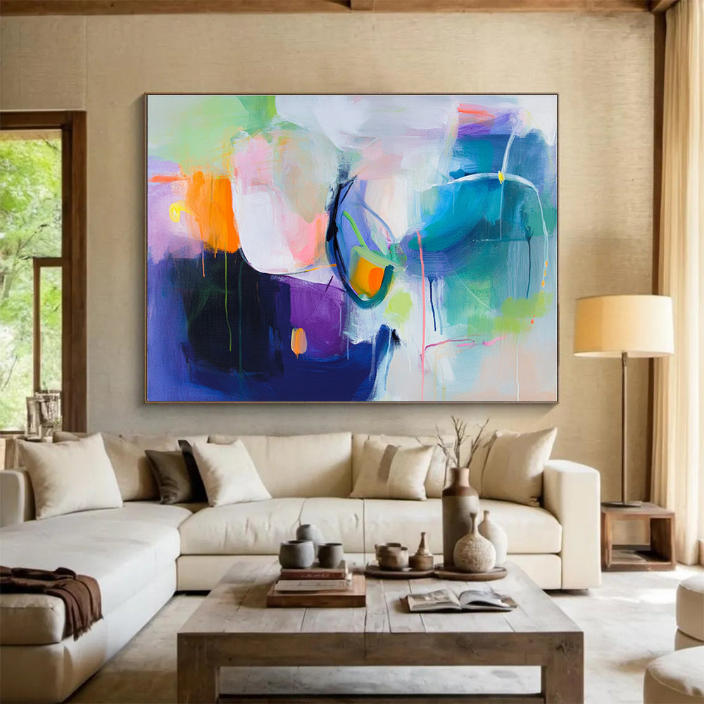 A large abstract painting featuring a colorful background with soft shapes and bold colors, evoking movement and energy with hints of pink blue green and more.SC312