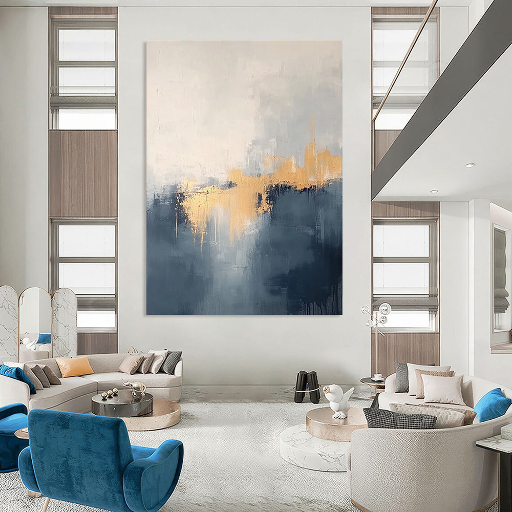 Large abstract painting in grey and blue tones with gold accents creating a dreamy misty atmosphere.STSC731