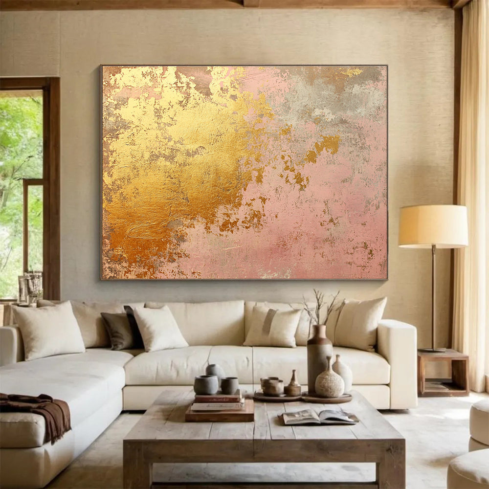 A large abstract canvas in soft pink and gold tones evokes rustic charm with weathered texture and hints of rust, ideal for home decor.SC480