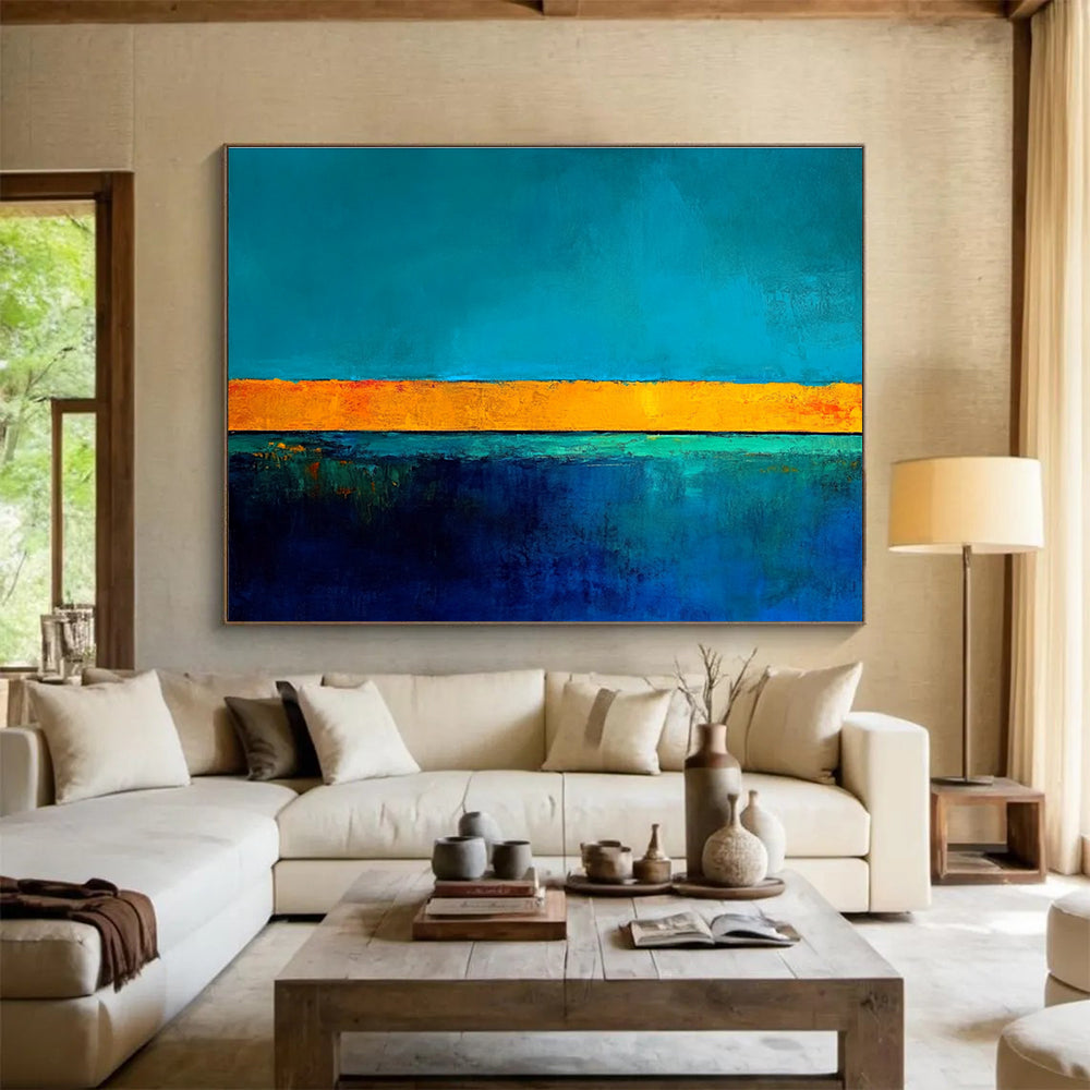 Large abstract painting featuring bold blue and yellow contrasts with a tranquil turquoise base and gold lines inspiring serenity and calmness.SC492