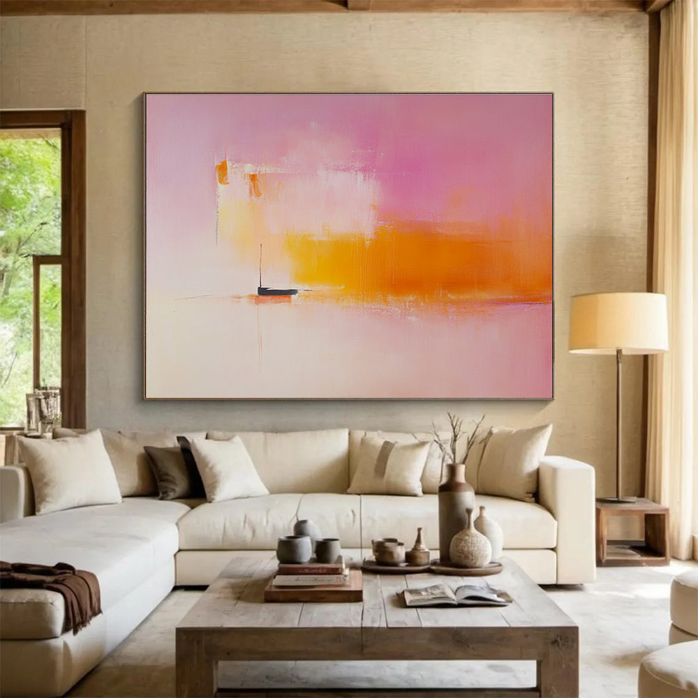 Large abstract painting featuring light pink and orange hues with a small boat on the horizon in a minimalist blurred landscape.SC330