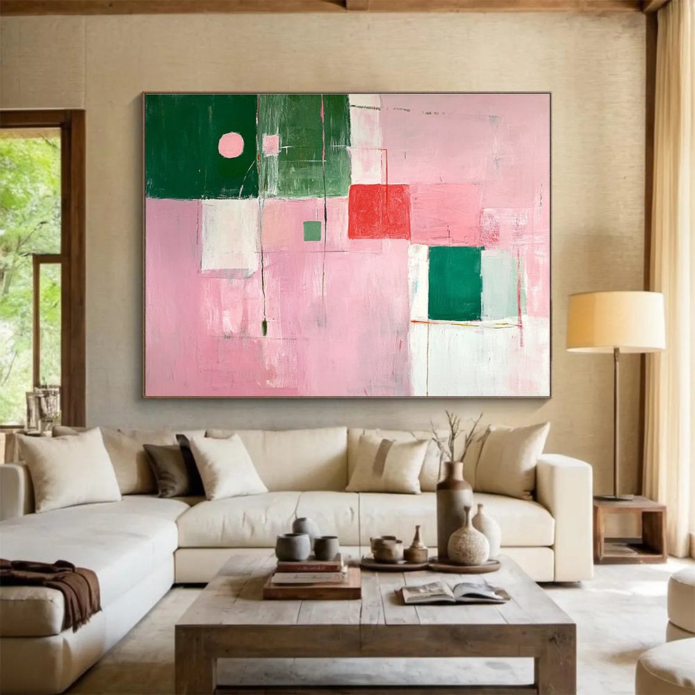 A large abstract painting featuring soft pink and green shapes creates a calming atmosphere with an inviting glow and an empty center.SC538