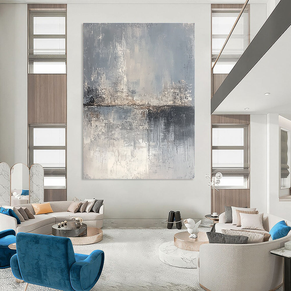 Large abstract painting depicting a serene landscape in gray and beige tones, featuring canvas texture and an atmospheric quality.STSC063