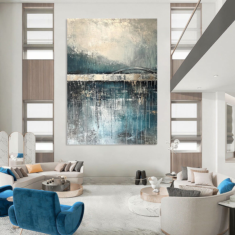 Large abstract painting depicting rain reflections on water with an old bridge in gray and blue tones accented with silver on textured canvas.STSC326
