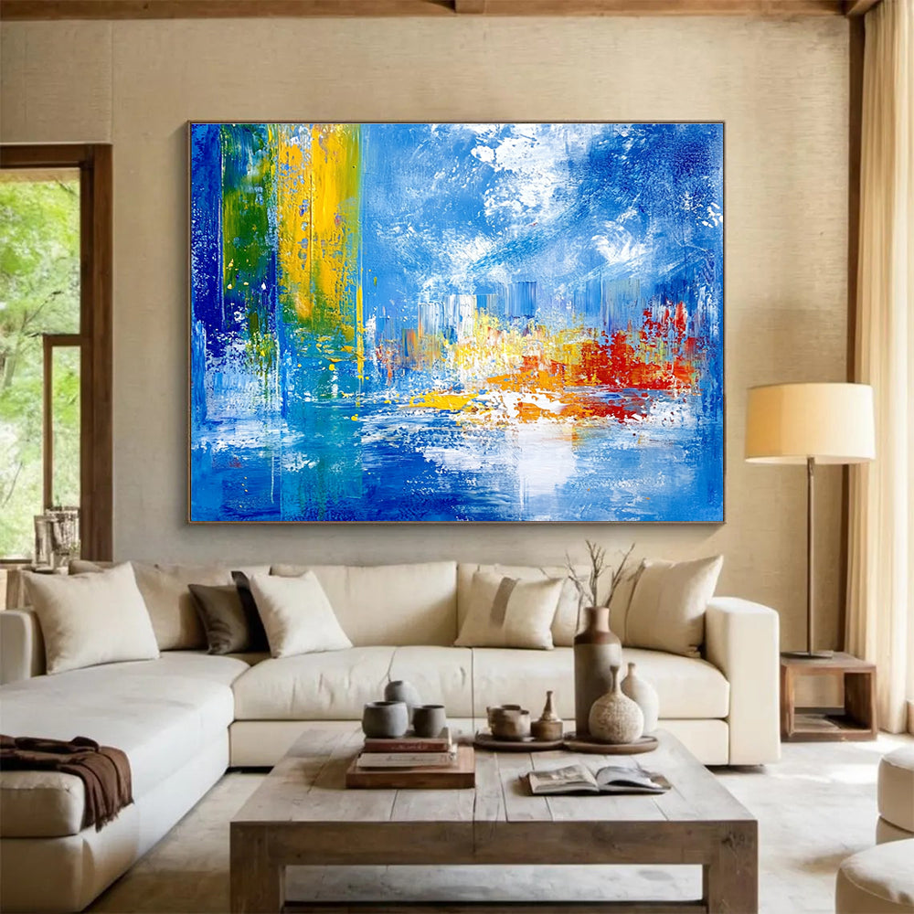 Bold abstract painting with vibrant teal yellow and red colors depicting an underwater city under sea ice against a blue sky and cloud backdrop.SC028