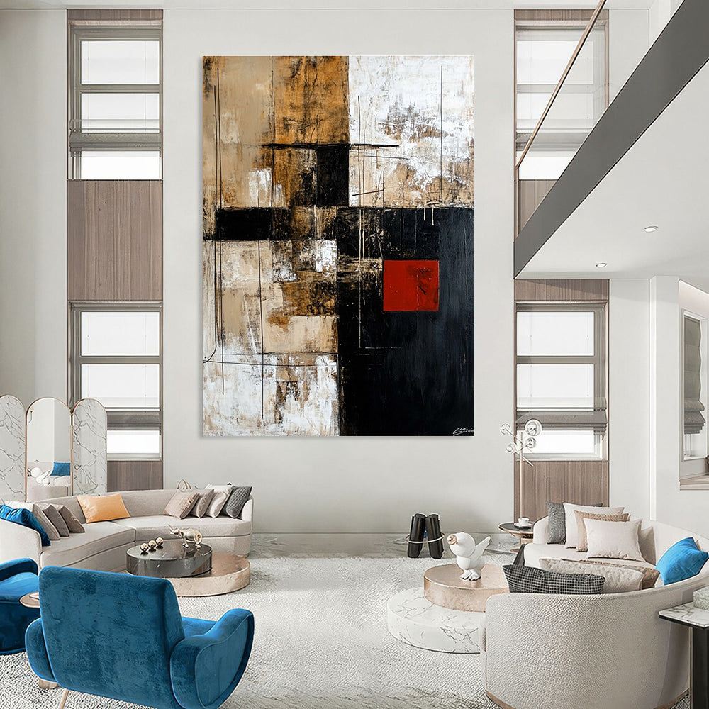 Large abstract painting in black brown beige and white with striking red square adds contrast to the dynamic design.STSC391