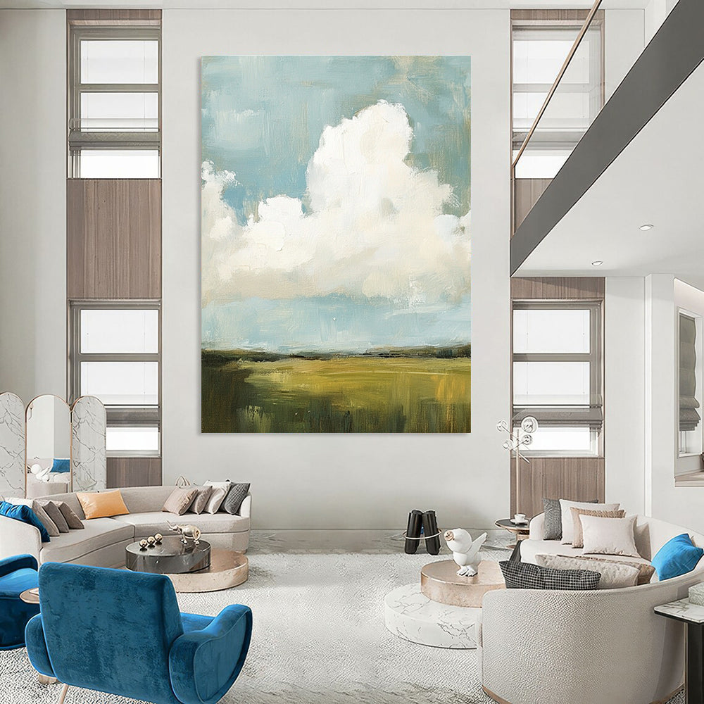 Large abstract painting featuring fluffy white and gray clouds over green grass fields with visible brush strokes and muted colors, creating a detailed scene.STSC873