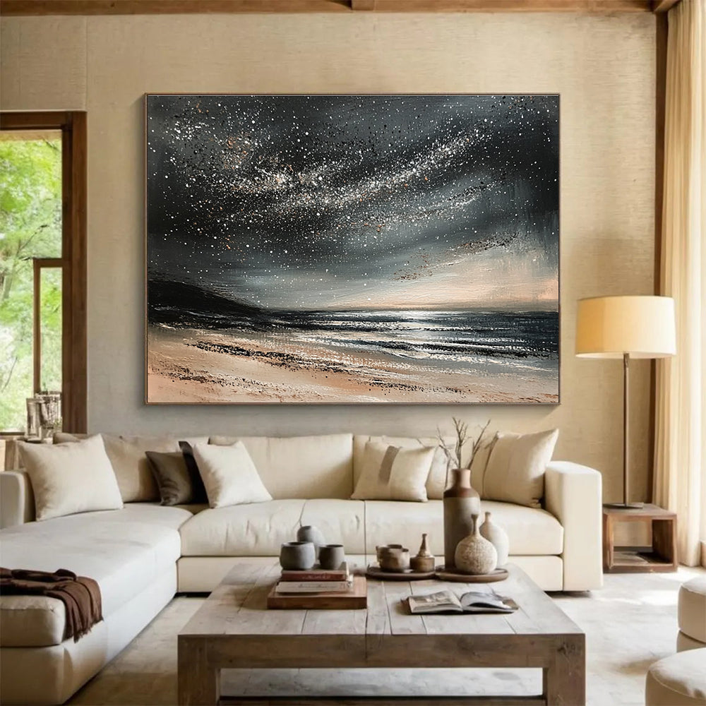 A large abstract painting depicting a calm ocean under a starry night sky with gentle waves and muted gray and black tones.SC528