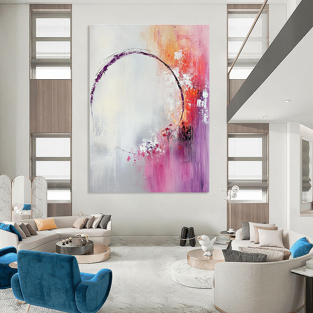Large abstract painting featuring light pink and white shapes with a soft gray background and tranquil accents of purple and red.STSC429