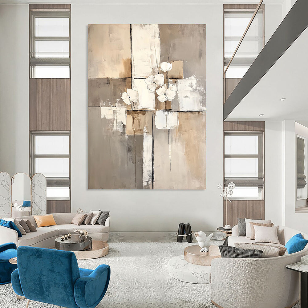 Large abstract painting featuring white paint blocks with a beige and gray palette on a neutral beige background.STSC431