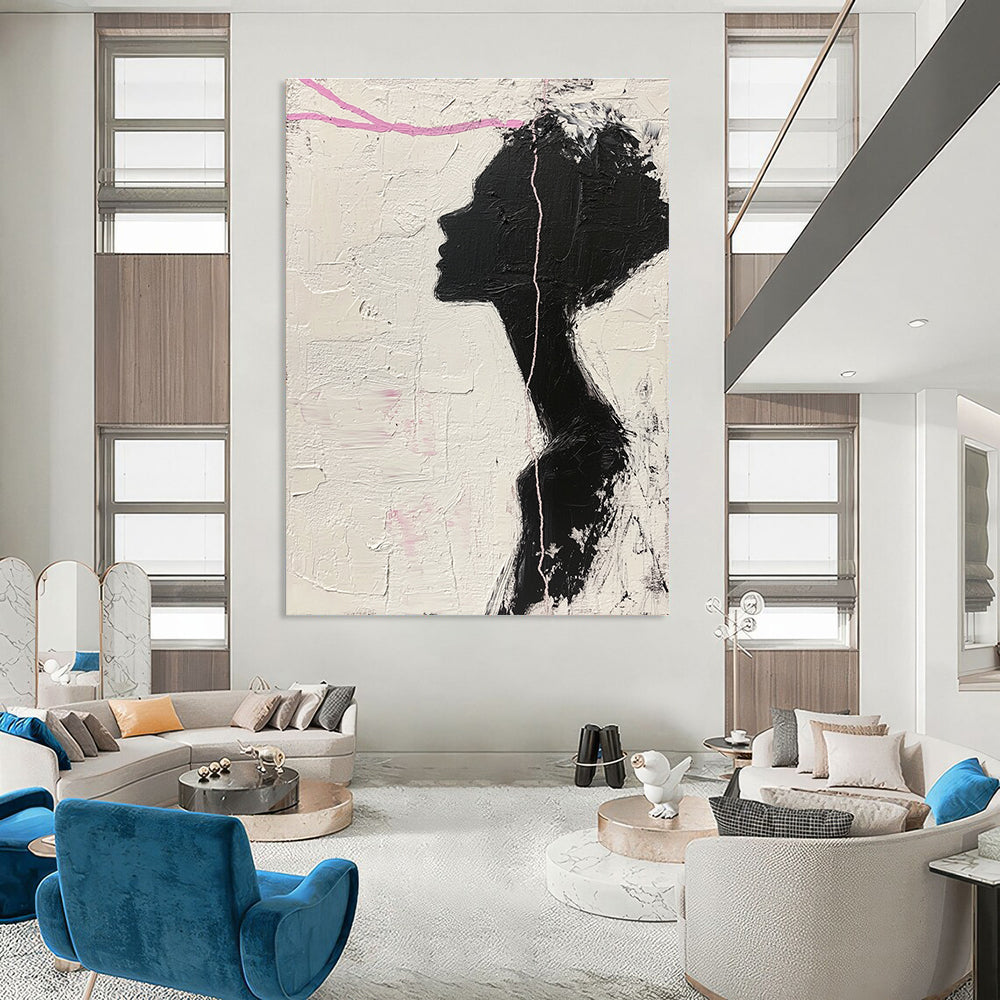 Large abstract painting in black and white featuring a woman’s silhouette with pink accents enhancing her facial features against a textured background.STSC1091