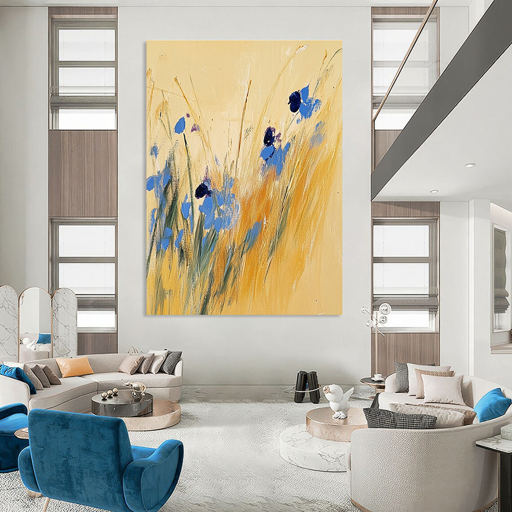 Large abstract painting of tall grass and blue wildflowers on a light yellow background inspired by Joseph Mallord William Turner.STSC336