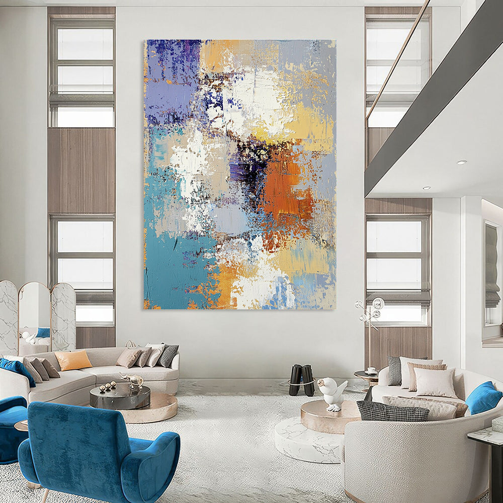 Large abstract oil painting featuring textured layers of blue yellow white gray beige and brown with intricate patterns and emotional depth.STSC584