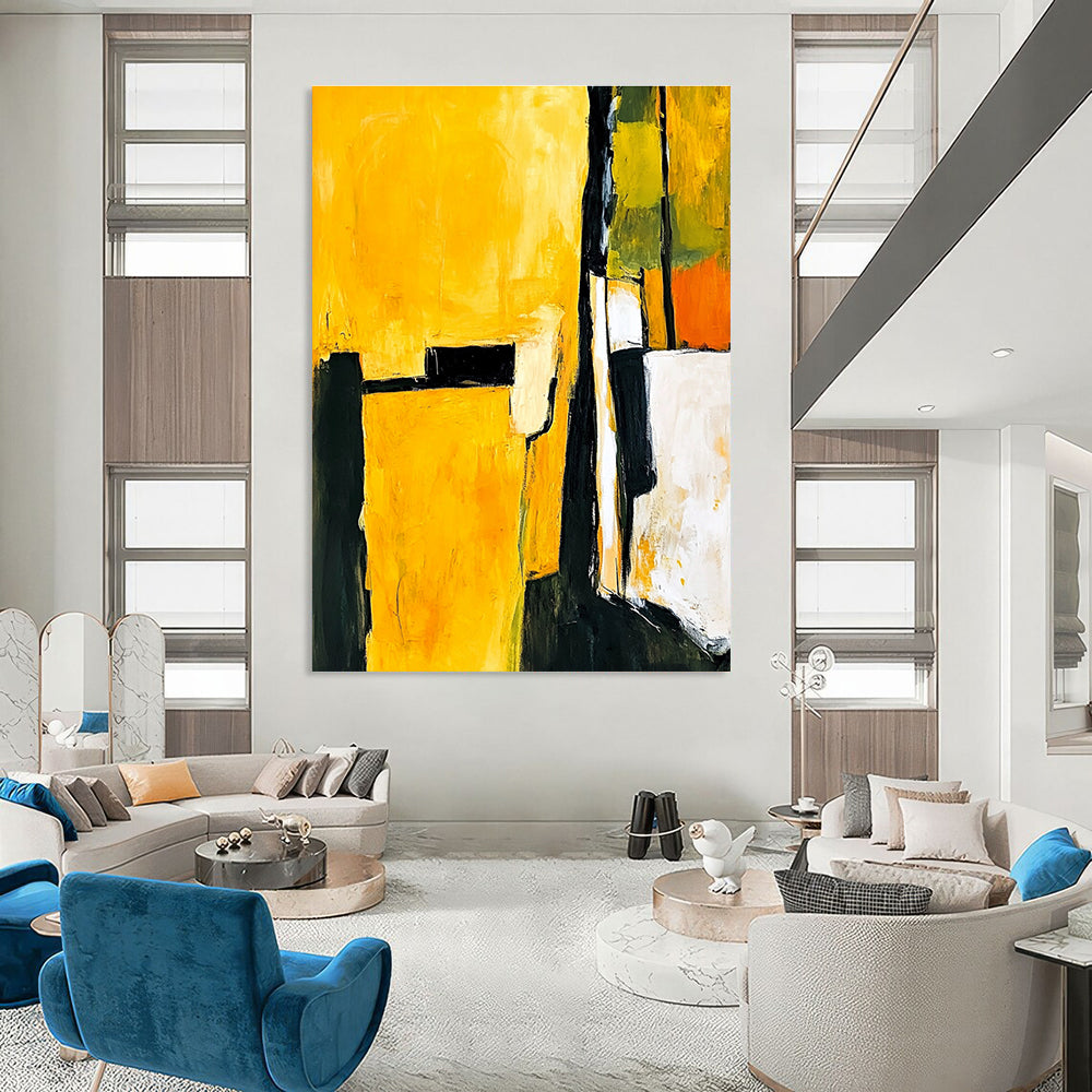 Abstract painting in yellow and black featuring white shapes with a minimalist atmosphere and an armchair in the foreground.STSC718