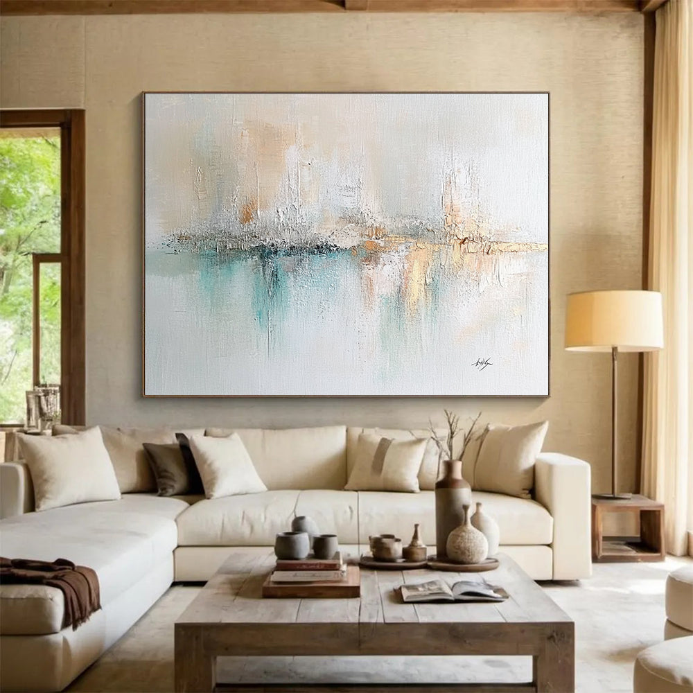Large abstract painting on textured canvas featuring soft pastels cream mint green muted blue and hints of gold with impressionist brushwork.SC208