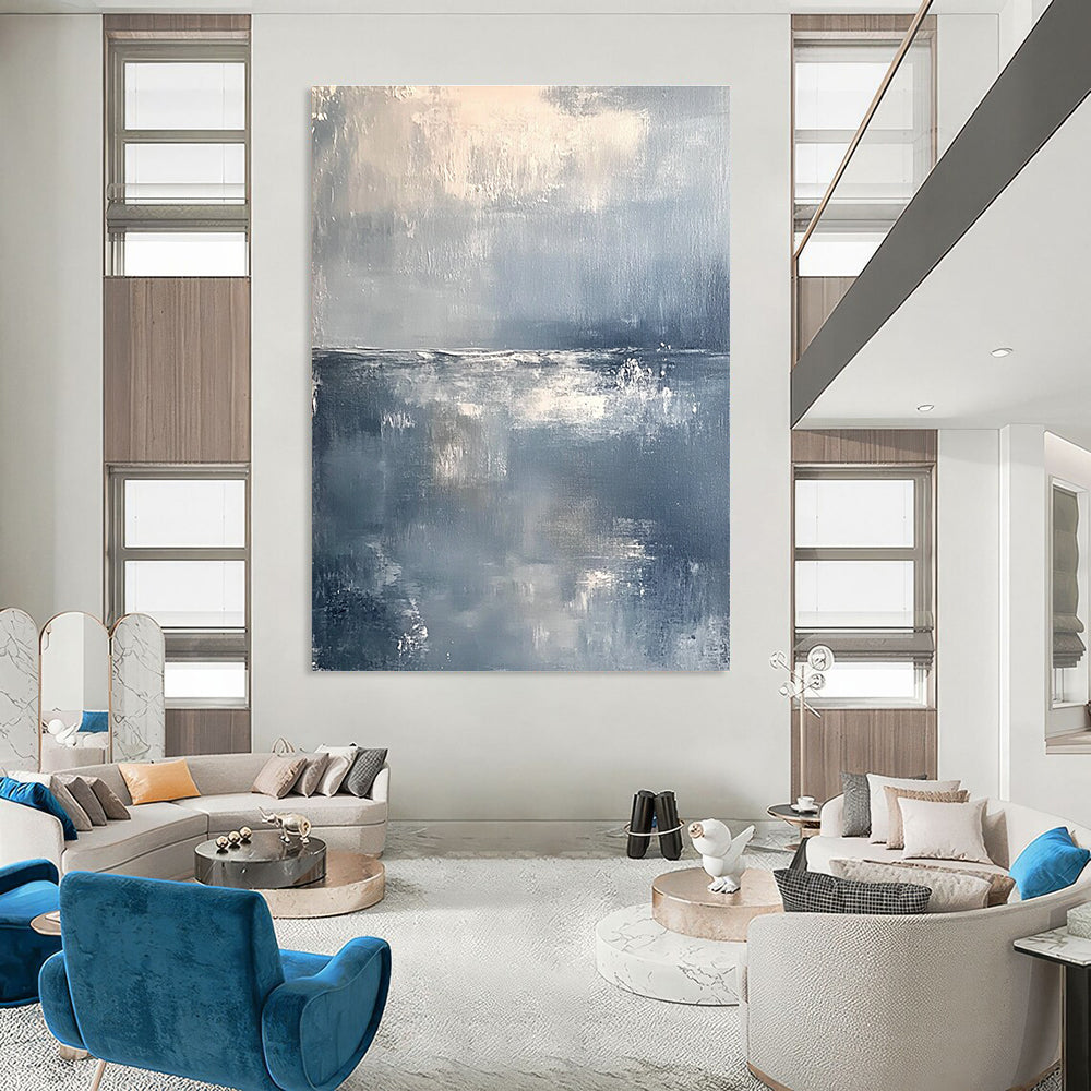 Large abstract painting of a serene ocean horizon in muted gray and white tones with soft brushstrokes conveying tranquility and elegance.STSC262