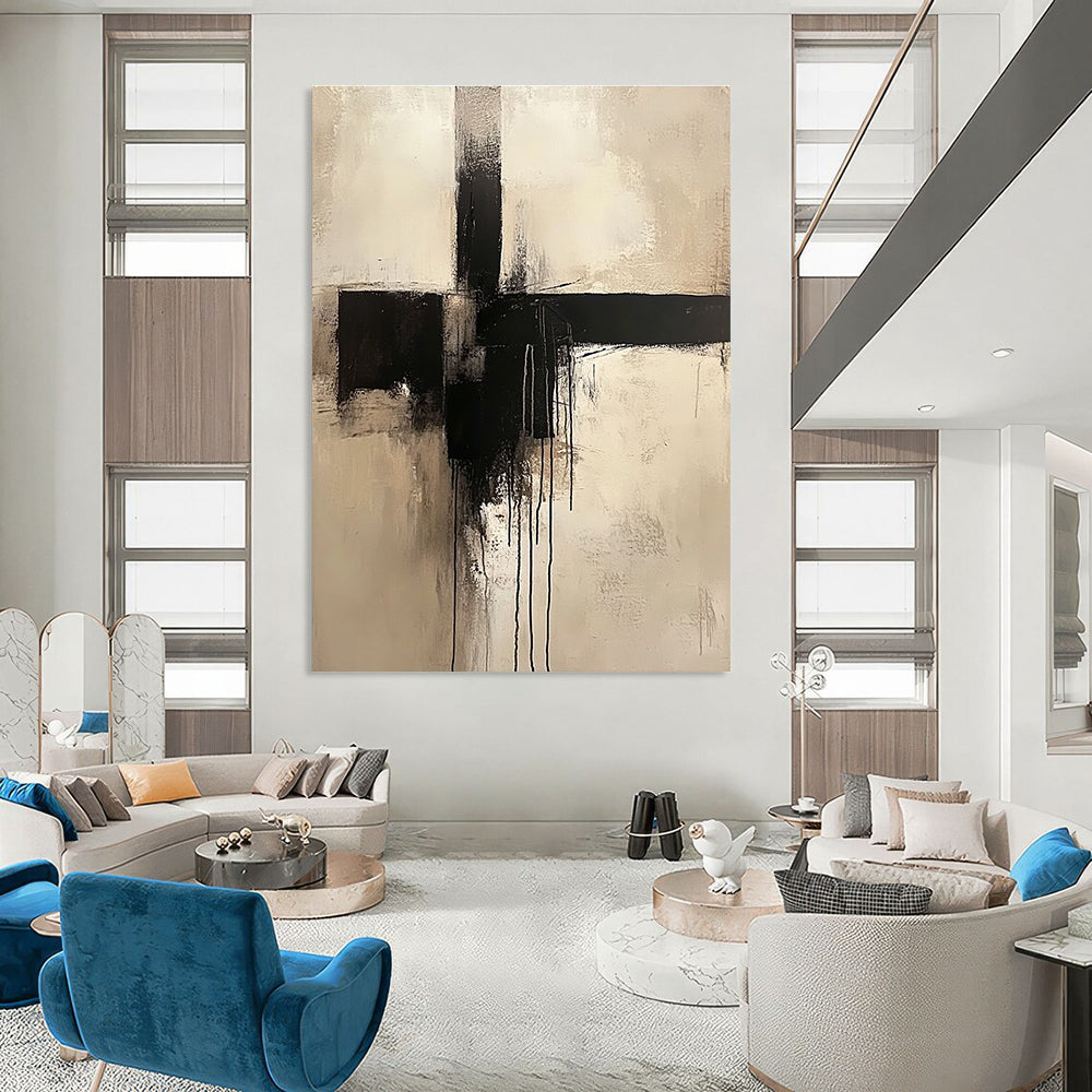 Large abstract painting of a cross in neutral colors featuring a minimalist style and dripping black paint.STSC669