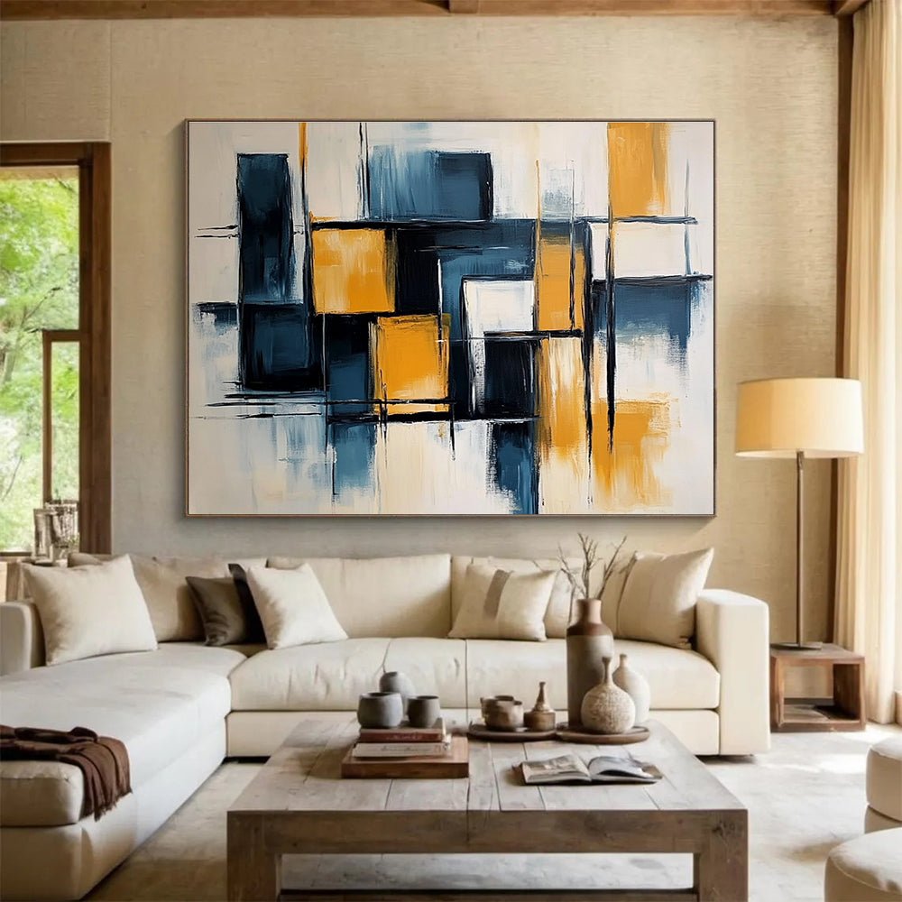 Large abstract painting with light blue and dark yellow color blocks, elegant black lines, geometric shapes, and a touch of orange on a white background.SC591