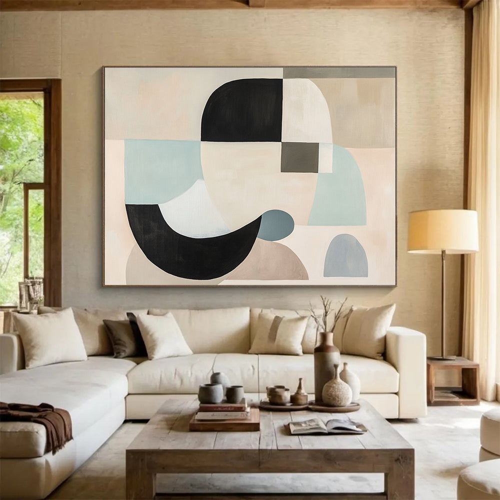 Large abstract painting with white, black, and grey shapes in soft pastel colors featuring geometric forms and a neutral beige background.SC510