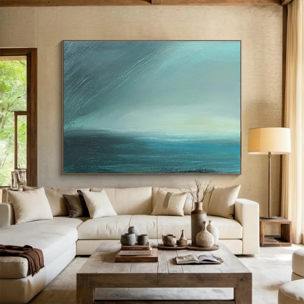 Large abstract painting in impasto technique featuring blue-green sea tones with fog and dark sky using thick, muted layers for atmospheric depth.SC497