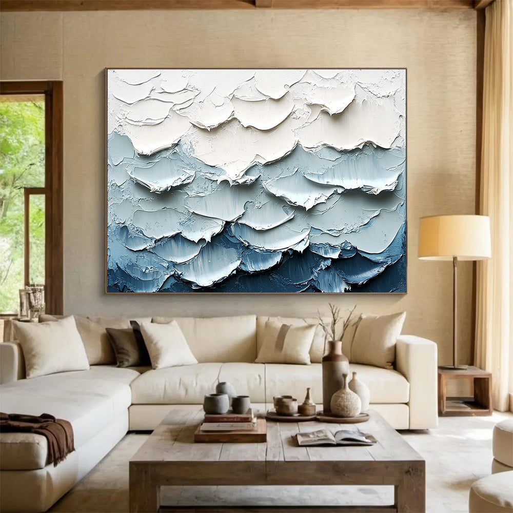 Large abstract painting of waves featuring a white and blue color palette with thick impasto texture for a striking visual effect.SC205
