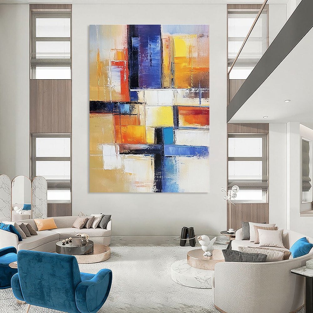 Large abstract painting of an urban landscape in warm colors featuring geometric shapes and soft lines on canvas.STSC153