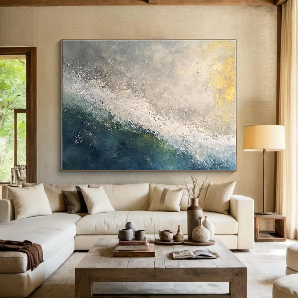 Large abstract oil painting of a stormy ocean at dawn featuring white and grey tones with touches of blue green and yellow.SC119