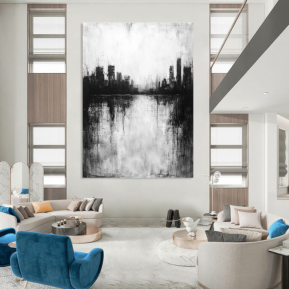Large abstract painting in black and white with city silhouette and lake reflection evokes calmness and mystery through minimalist heavy brushstrokes.STSC215