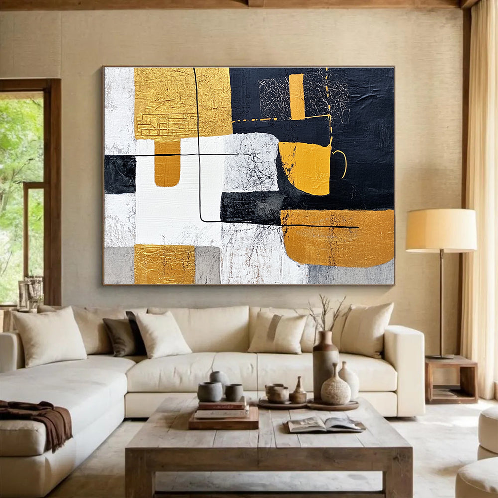 Large abstract painting featuring white and yellow shapes with black lines on a dark gray background inspired by Chinese landscapes and embellished with gold leaf.SC266
