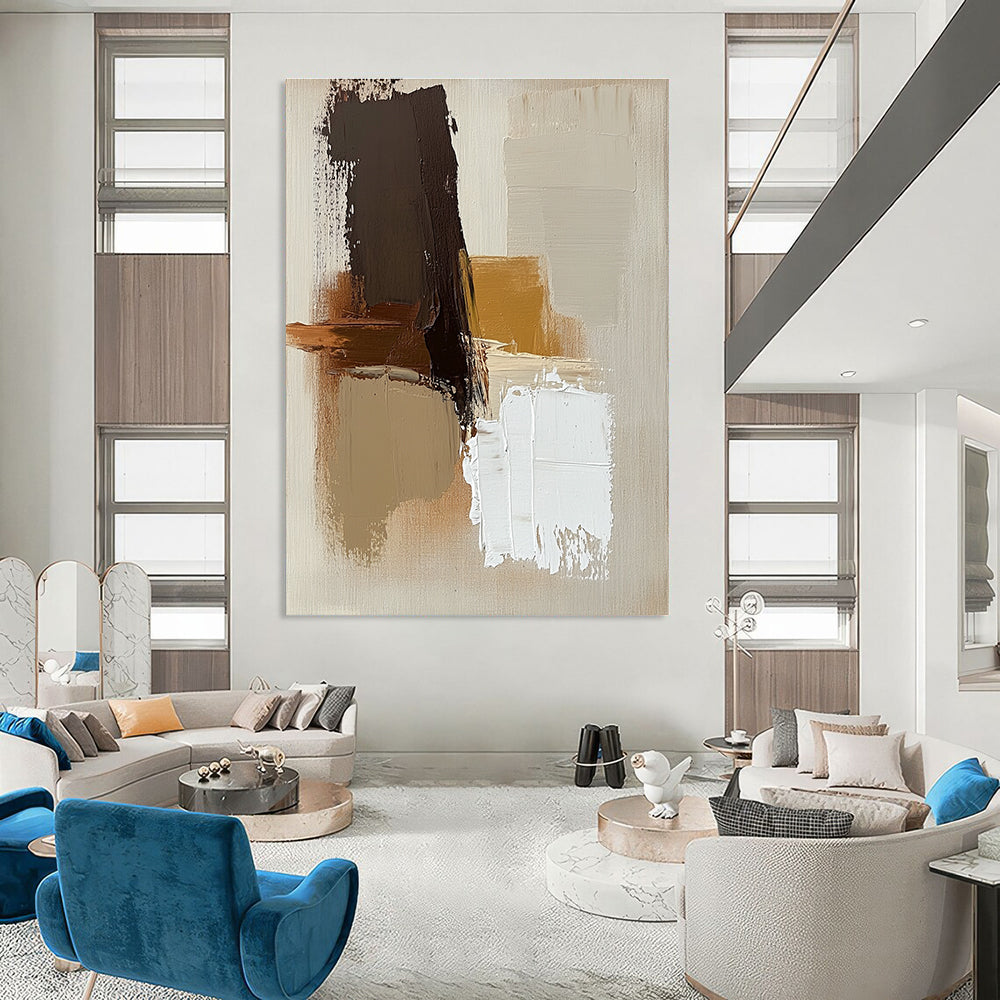Large abstract painting with brown beige and white colors featuring thick brush strokes and simple shapes on a neutral beige background.STSC747