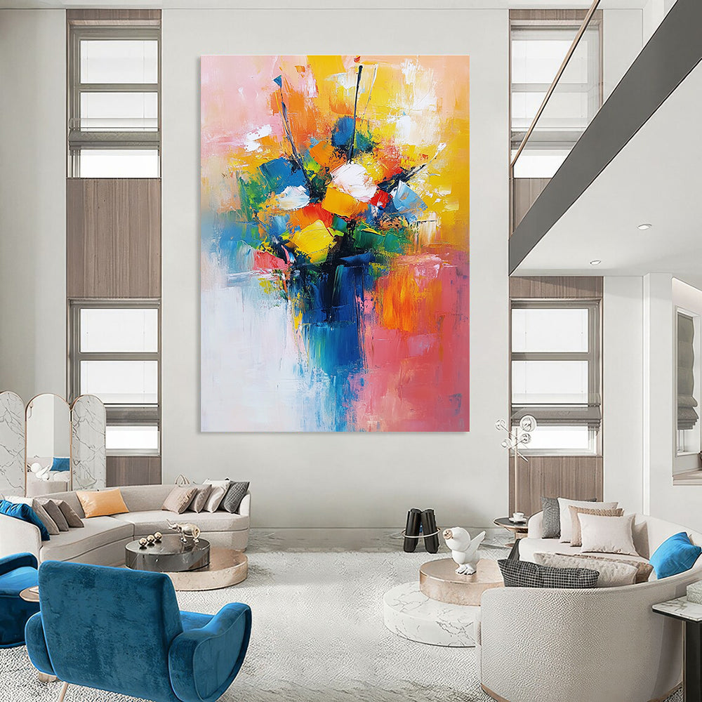 Large abstract painting featuring a vibrant bouquet in yellow blue and red with a light pink orange background conveying joy and calmness.STSC251