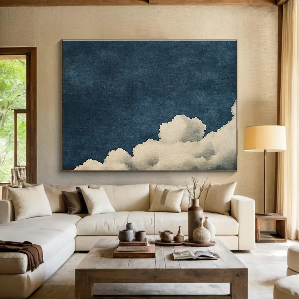 Large abstract painting of clouds on textured canvas featuring high contrast white clouds against a minimalist dark blue background.SC523