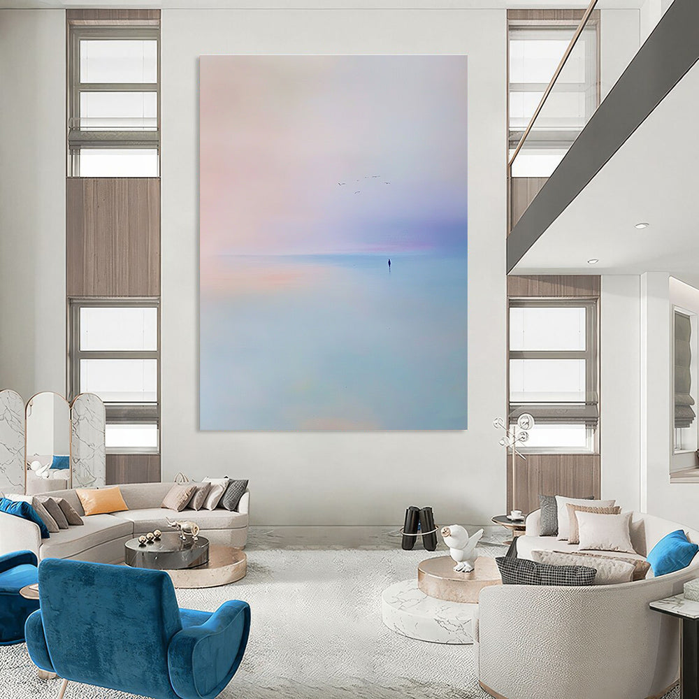 Abstract painting of the sea featuring a light blue and purple sky with soft tones and minimalist style capturing a serene beach scene with flying birds.STSC346